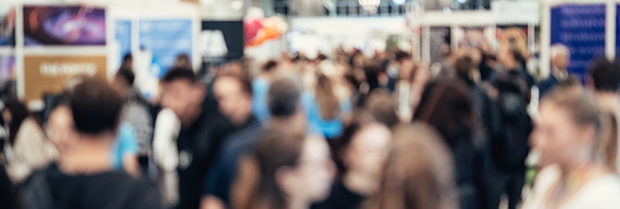 Blurred crowd at a trade show exhibition