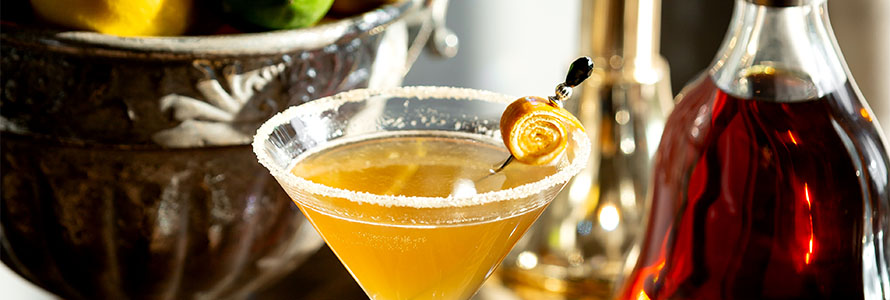 Golden martini with sugared rim and lemon peel garnish